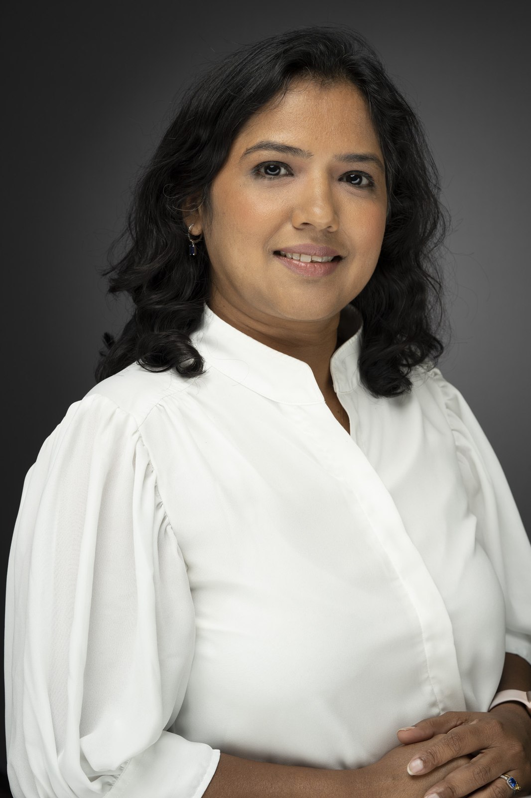 A warm, approachable headshot of a healthcare professional by Len Marks Photography