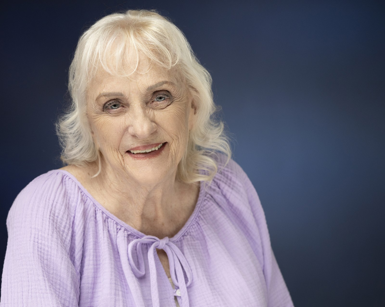 A warm, trust-building expression in a Len Marks Photography headshot